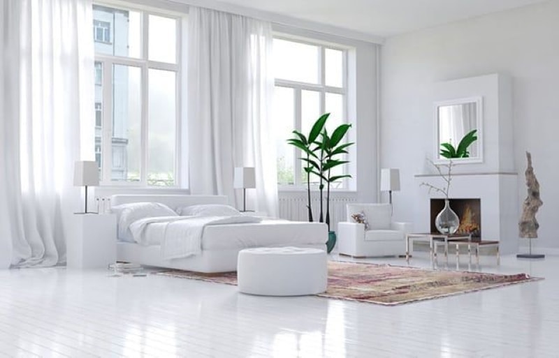 White bedroom with sitting area