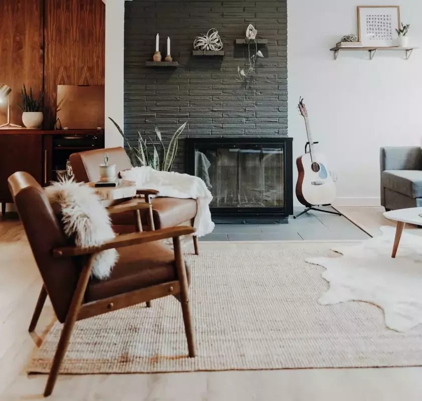 Awkward living room with corner fireplace and accent chairs